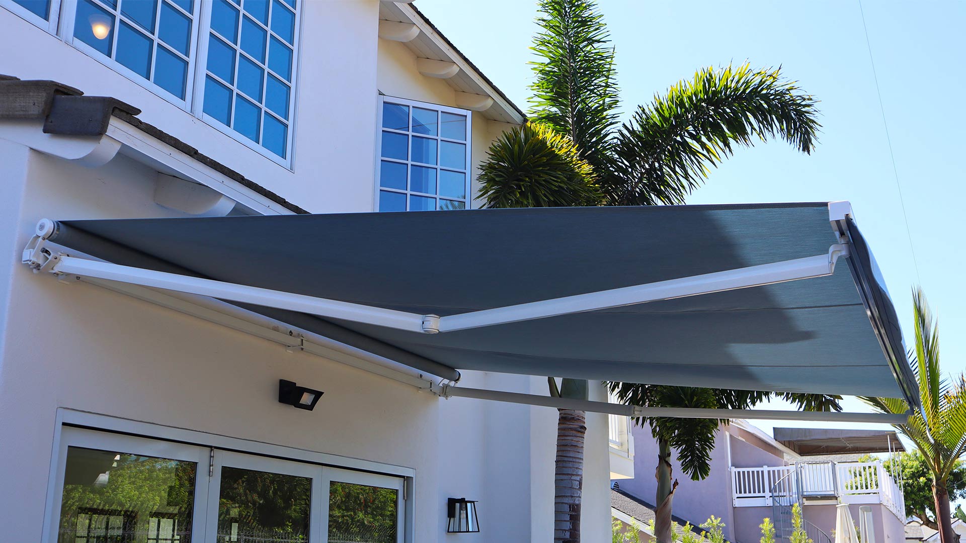 residential property exteriors side view with fabric awning installed san diego ca