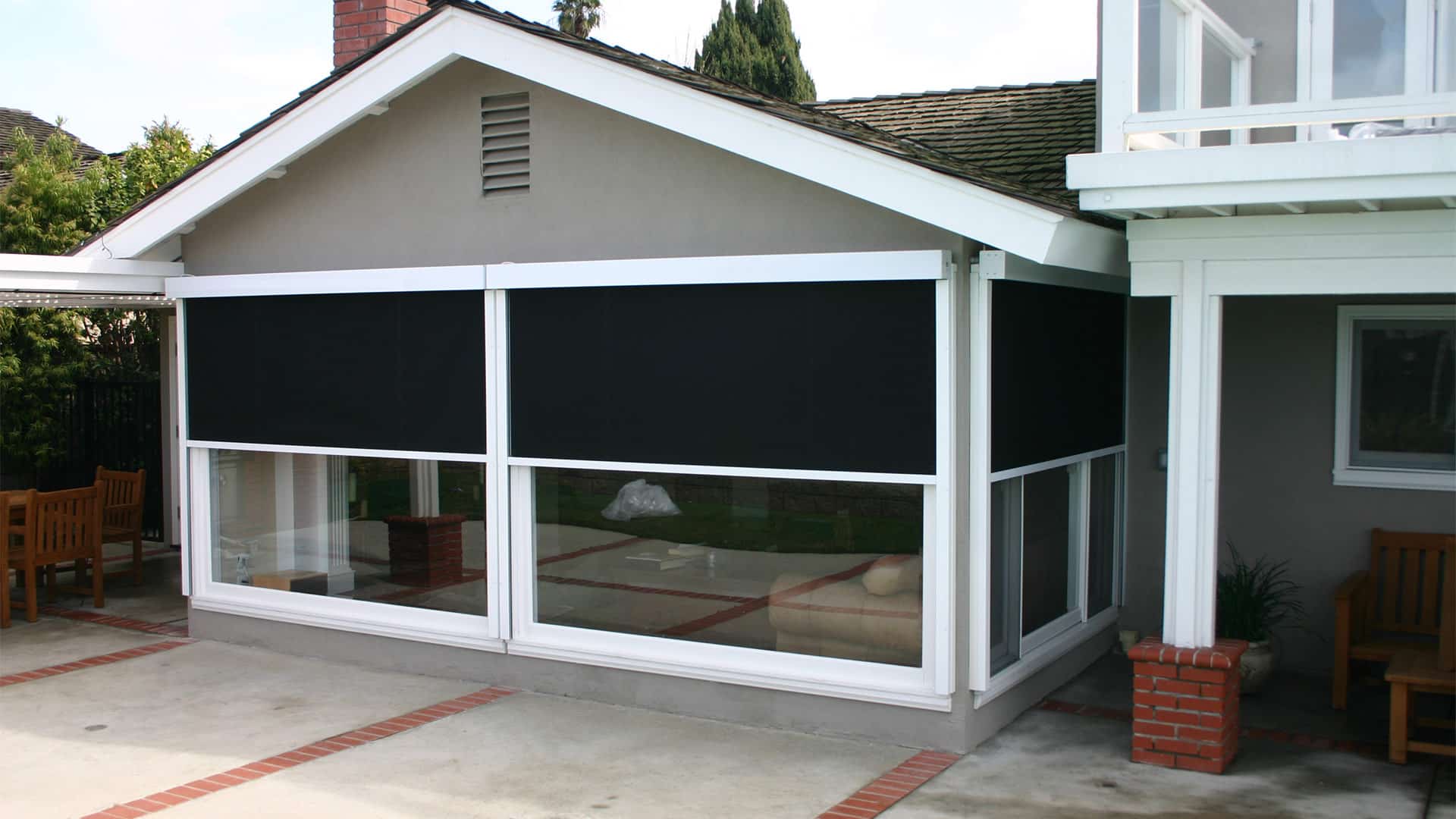 house patio view with outdoor roller shades installed santa ana ca