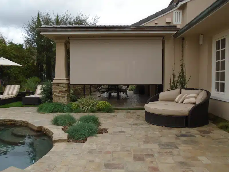 pro drop shade installed in a paved patio